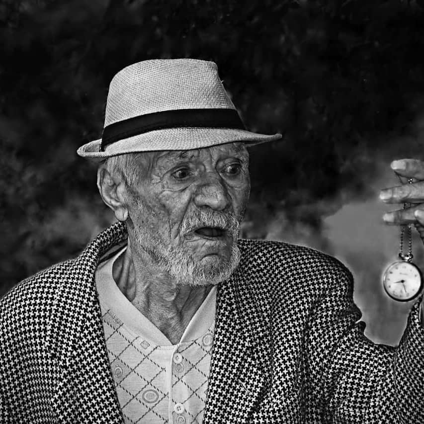 Man Holding Pocket watch