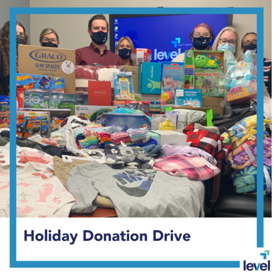 Level Financial Advisors teams up with Homespace Corporation to donate gifts to a family in need.