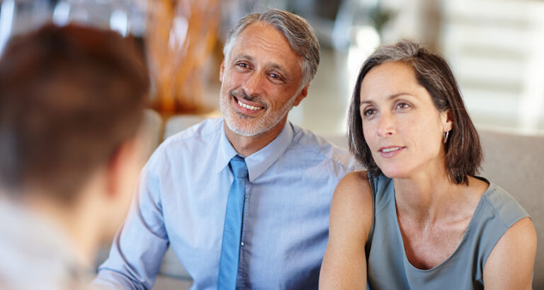 Couple having discussion with advisor